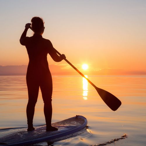 Paddleboarding into the sunset